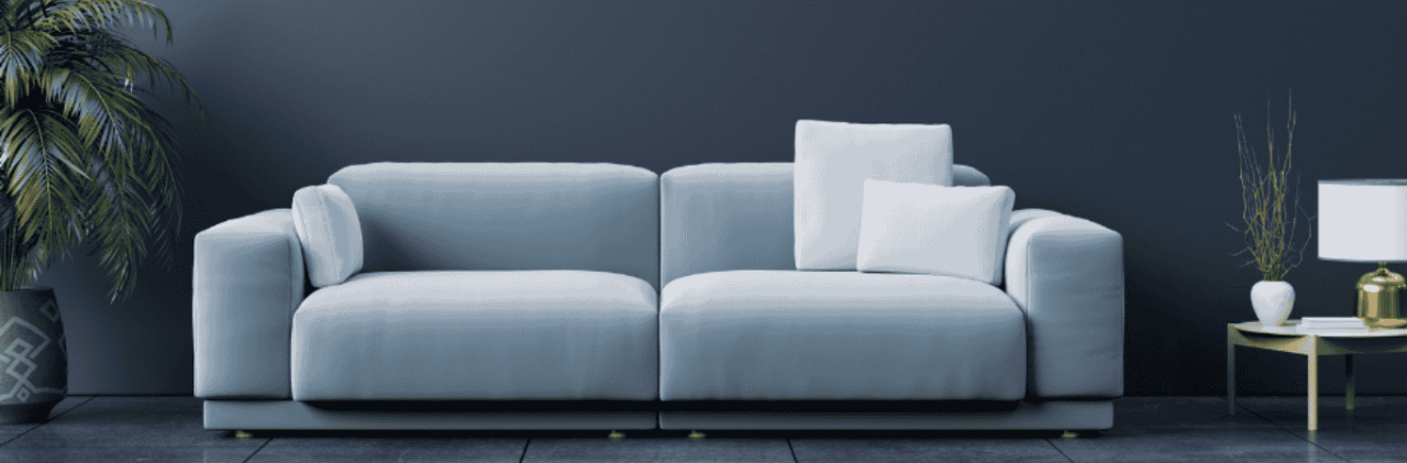 Modern Living Room With A Light Blue Sofa, Potted Plant, And Wooden Side Table - Beautiful Homes