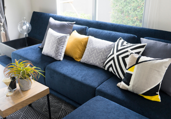 Blue Sofa with Geometric Patterns - Beautiful Homes