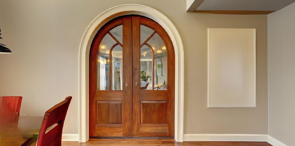 Wooden arched door entryway for dining room - Beautiful Homes