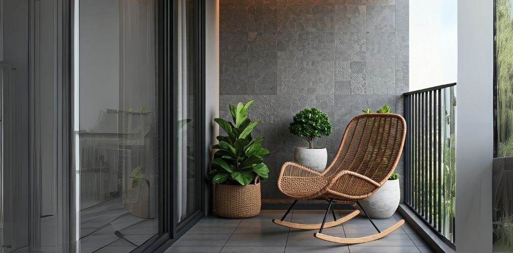 Balcony with textured wall, rattan chair, and plants - Beautiful Homes