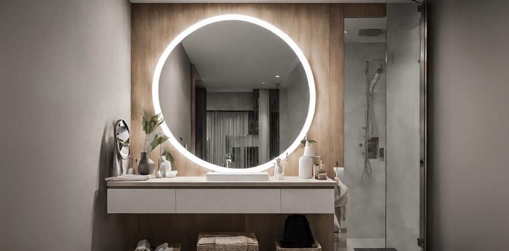 Bathroom design with circular led mirror and shower cubicle - Beautiful Homes