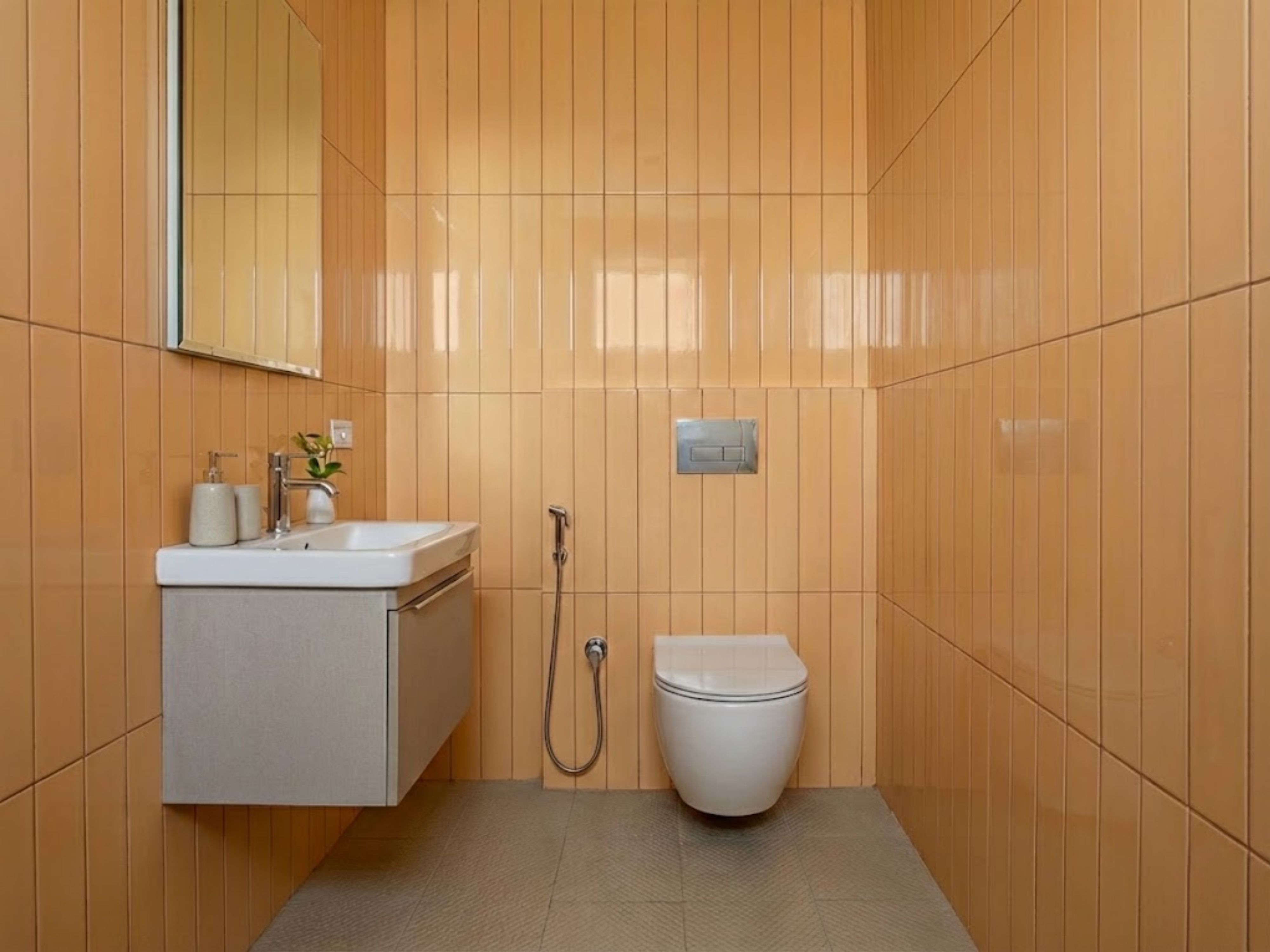 Modern bathroom with wall-mounted sink and toilet - Beautiful Homes