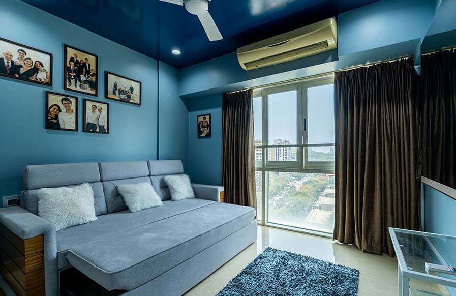 Bright and arresting blue-hued bedroom design with functional furnishings and distinctive decor accessories - Beautiful Homes