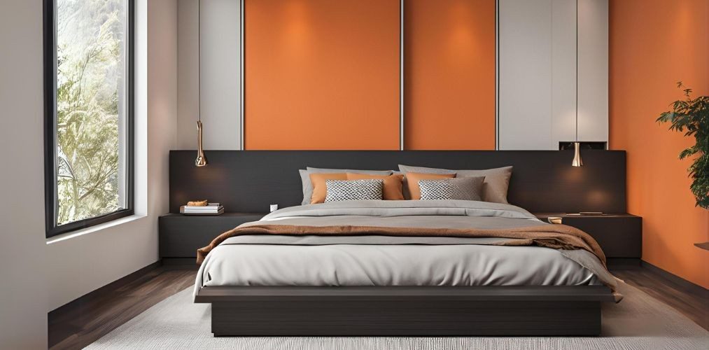 Compact master bedroom with king bed and orange walls - Beautiful Homes