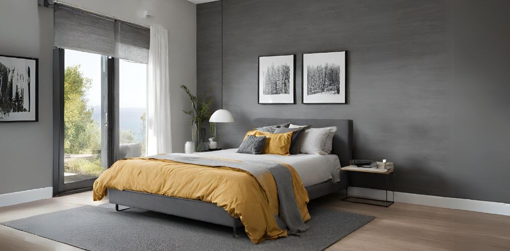 Grey bedroom design with yellow bedding and wooden flooring-Beautiful Homes