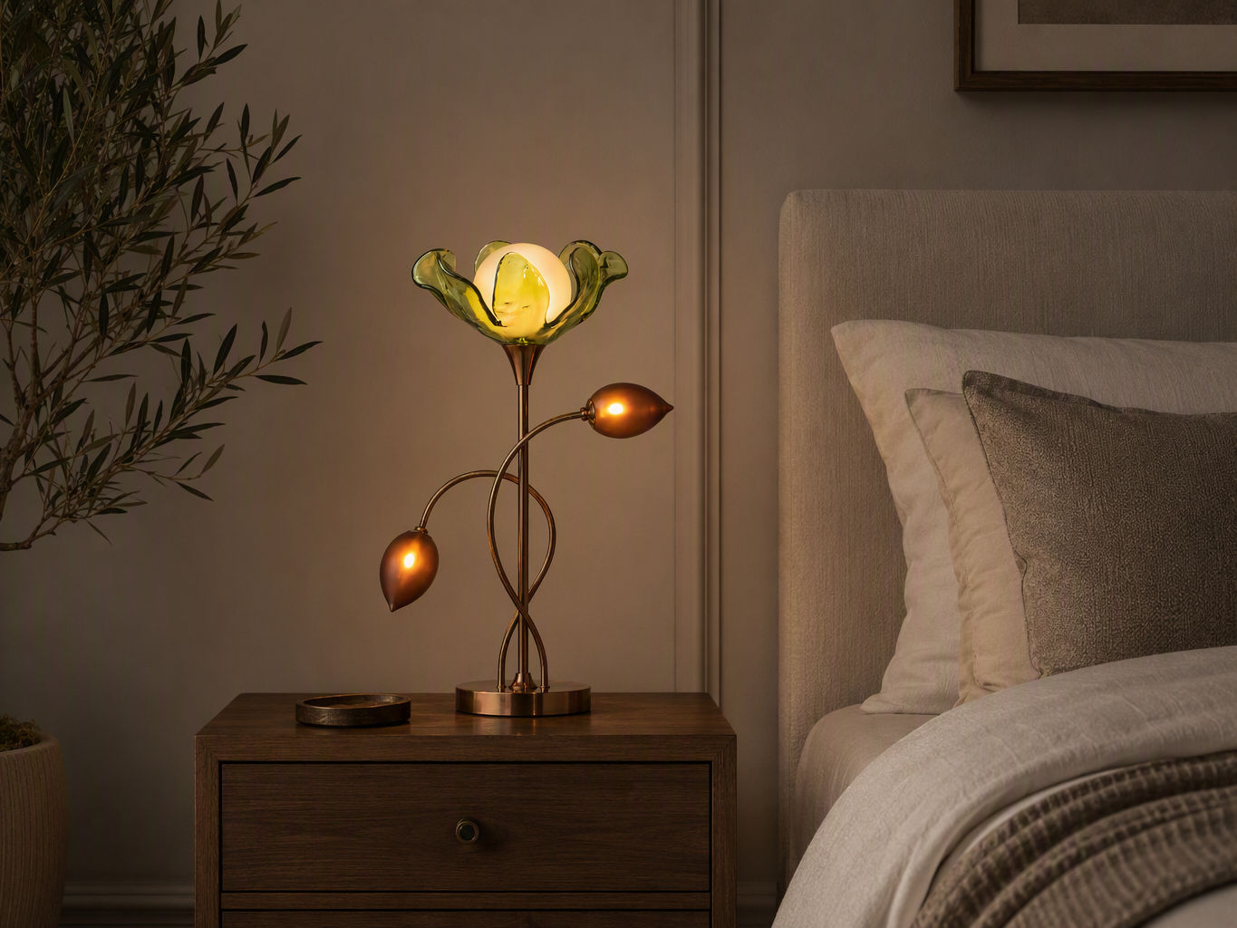Botanical-inspired bedside table lamp with a bronze metal stem, and green petal-shaped glass shade - Beautiful Homes