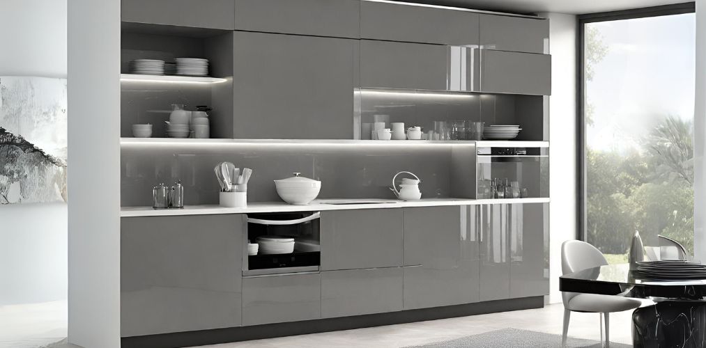 Modern crockery unit with glass front cabinets and glossy grey laminate - Beautiful Homes