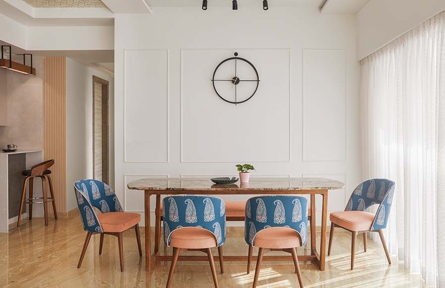 Contemporary dining room design with traditional pattern furnishing on dining chairs - Beautiful Homes