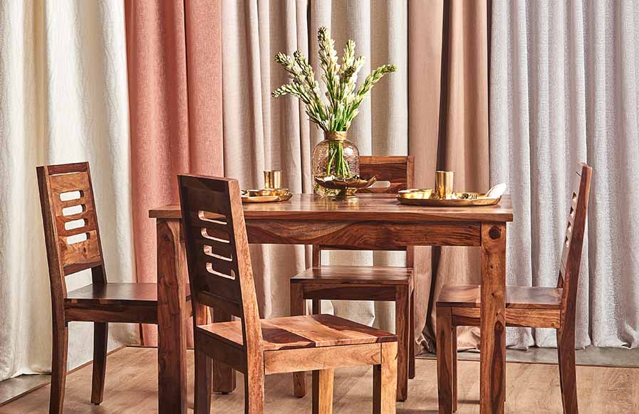 Wooden dining room design with colourful curtains - Beautiful Homes
