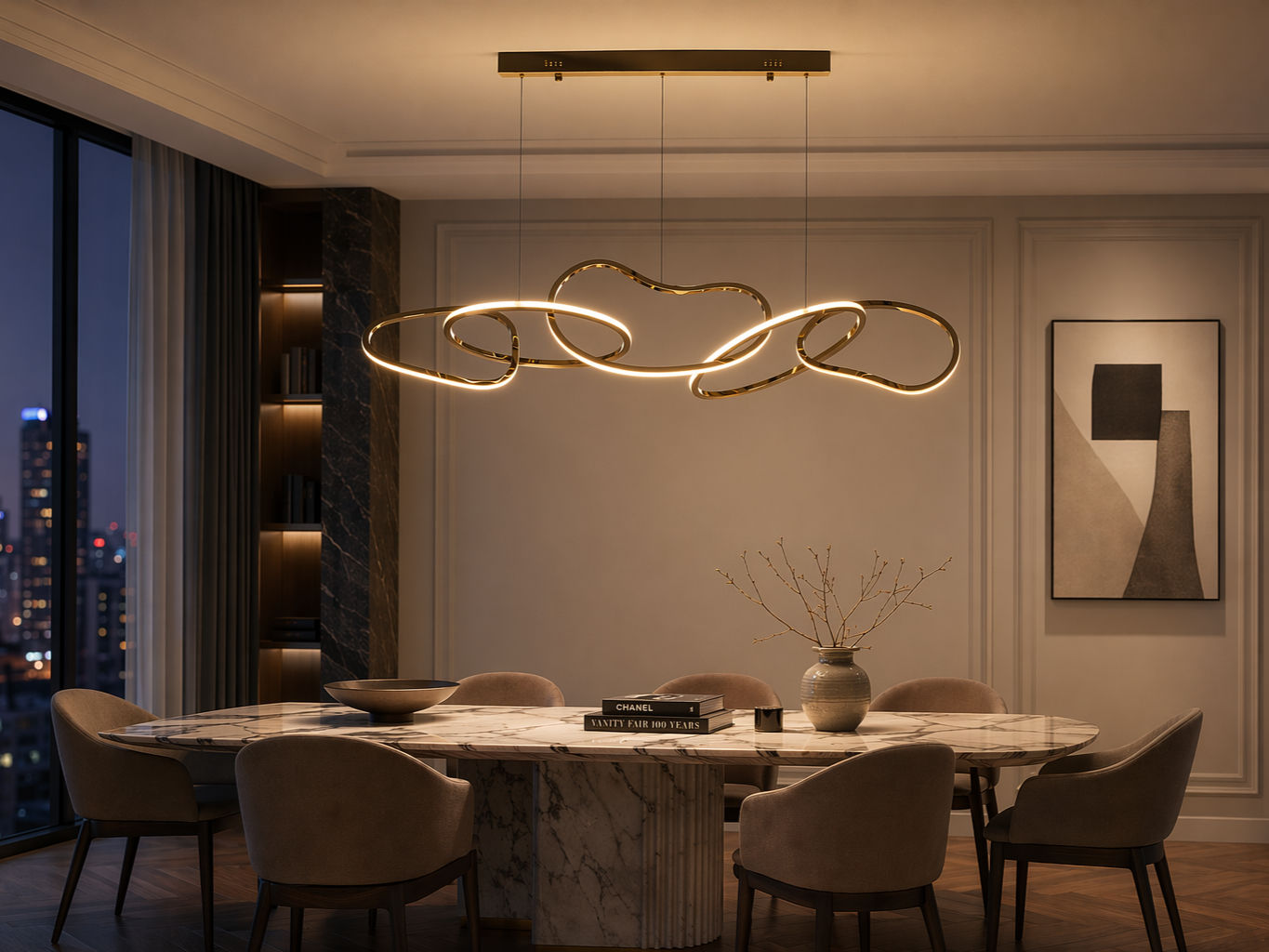 Modern gold-finished chandelier with interlocking organic LED loops, suspended above a marble dining table - Beautiful Homes