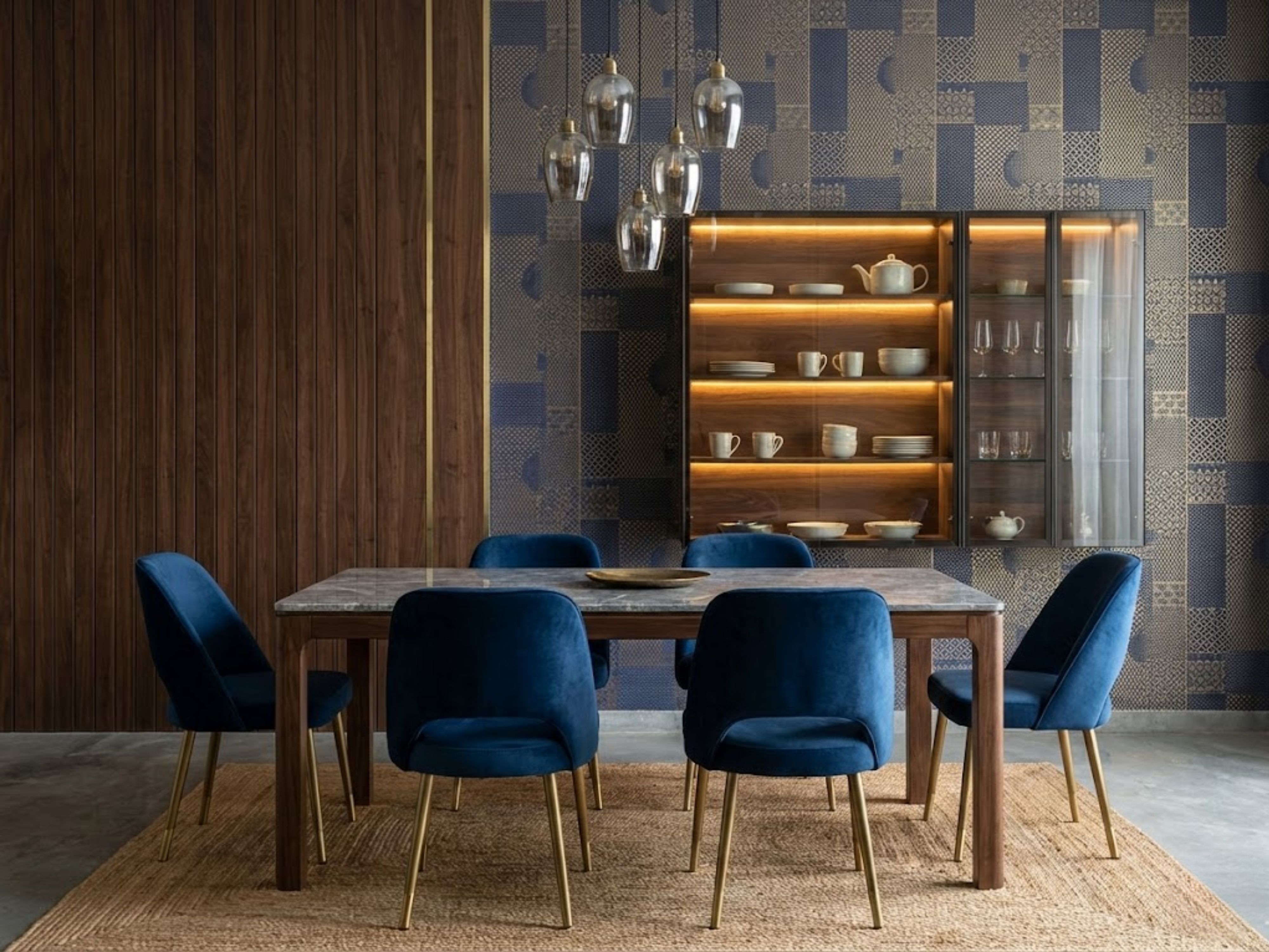 Dining room with marble table and wooden décor - Beautiful Homes