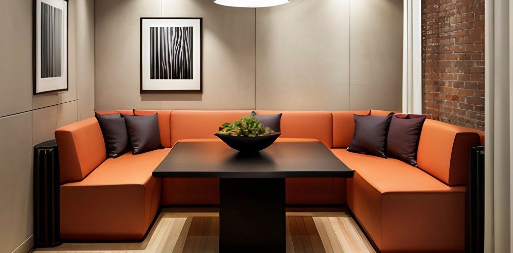 Dining room with orange sofa seater and wooden table-Beautiful Homes