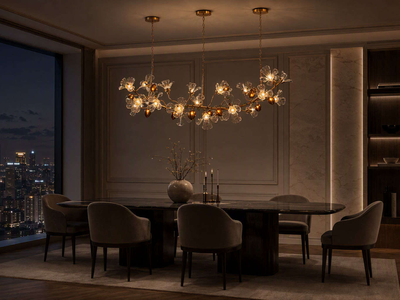 Modern linear chandelier with brass branches and clear glass floral shades suspended above a dining table - Beautiful Homes