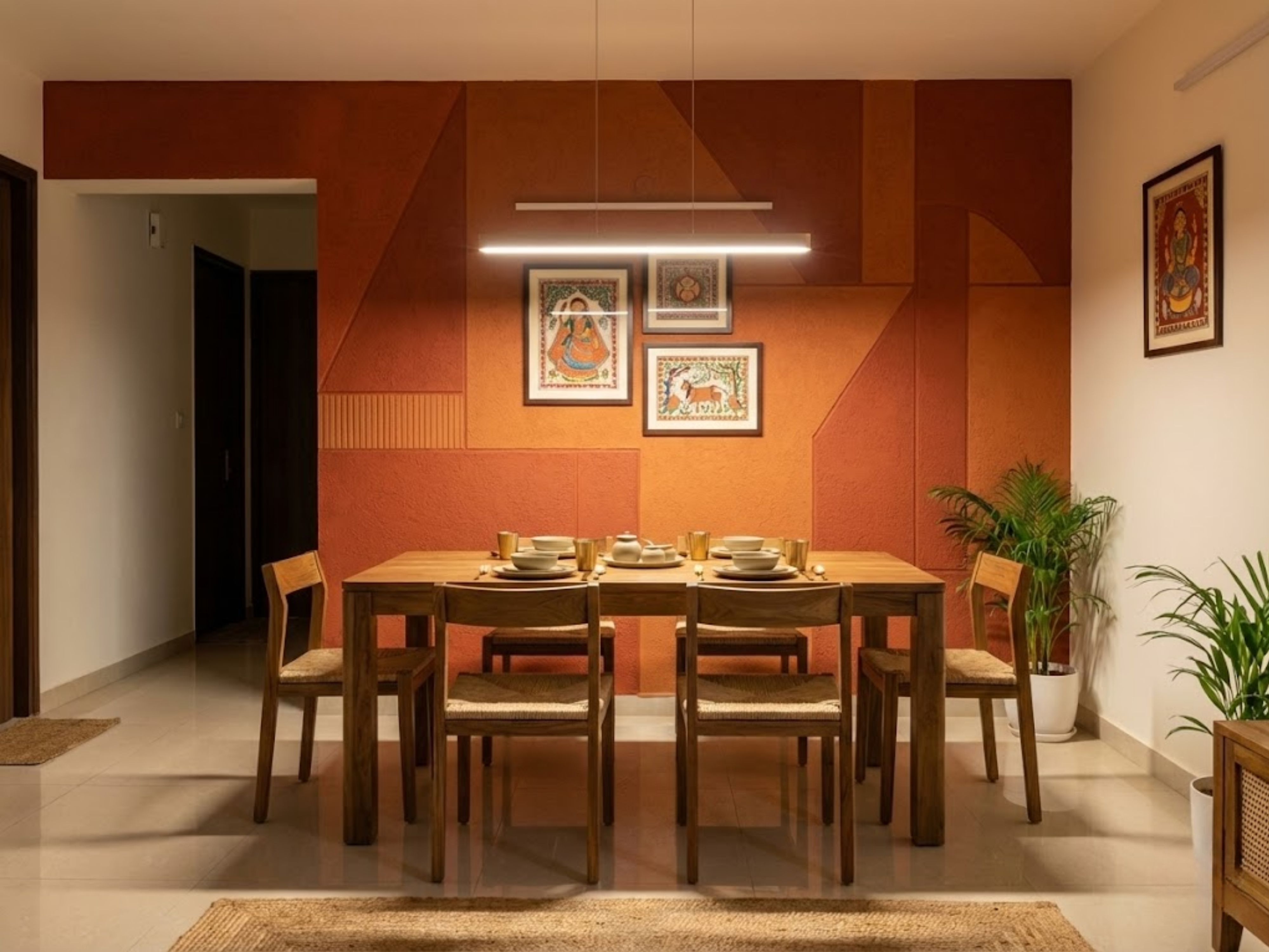 Dining room with wooden table, chairs, and warm décor - Beautiful Homes