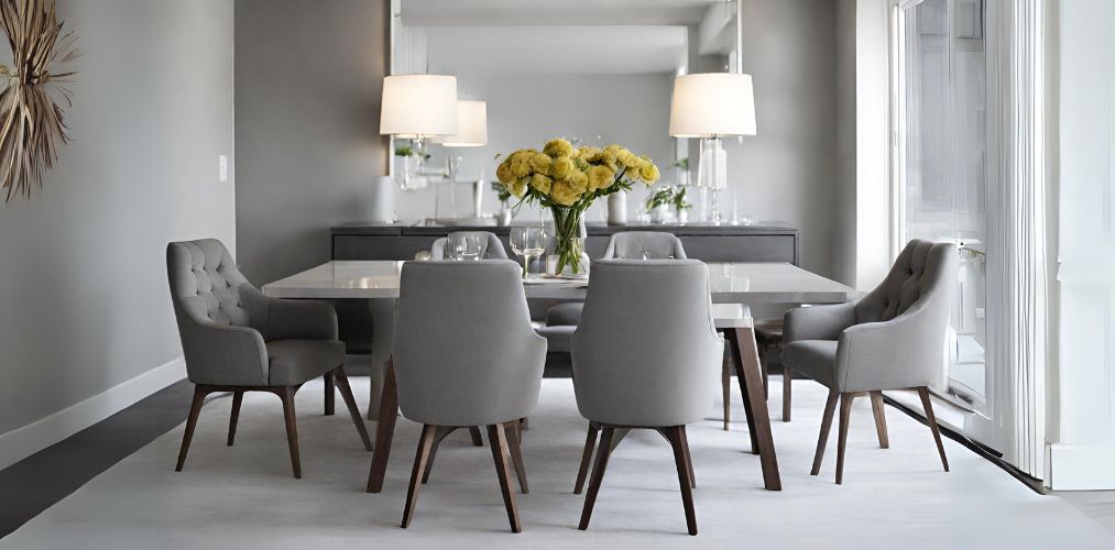 Modern dining room with grey tufted chairs - Beautiful Homes