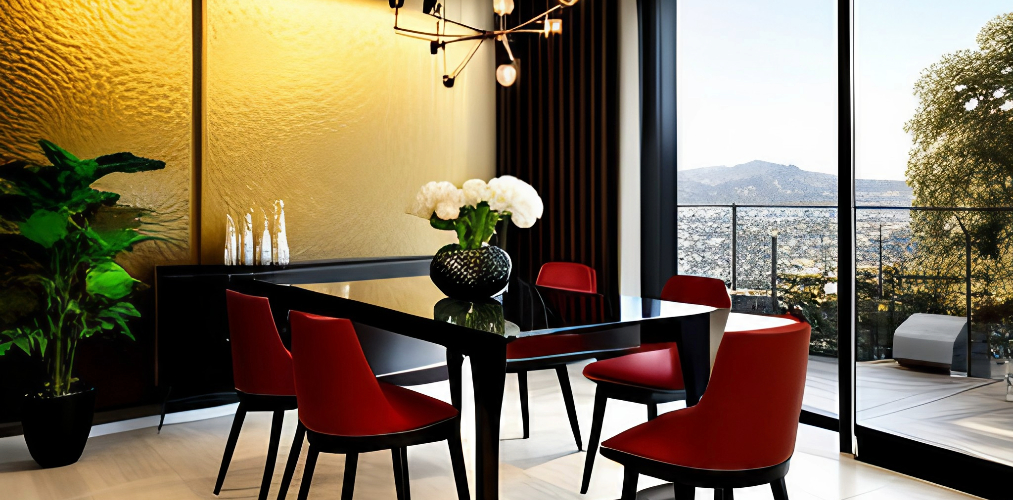 Modern dining room with metal table and golden accent wall with red chairs-Beautiful Homes