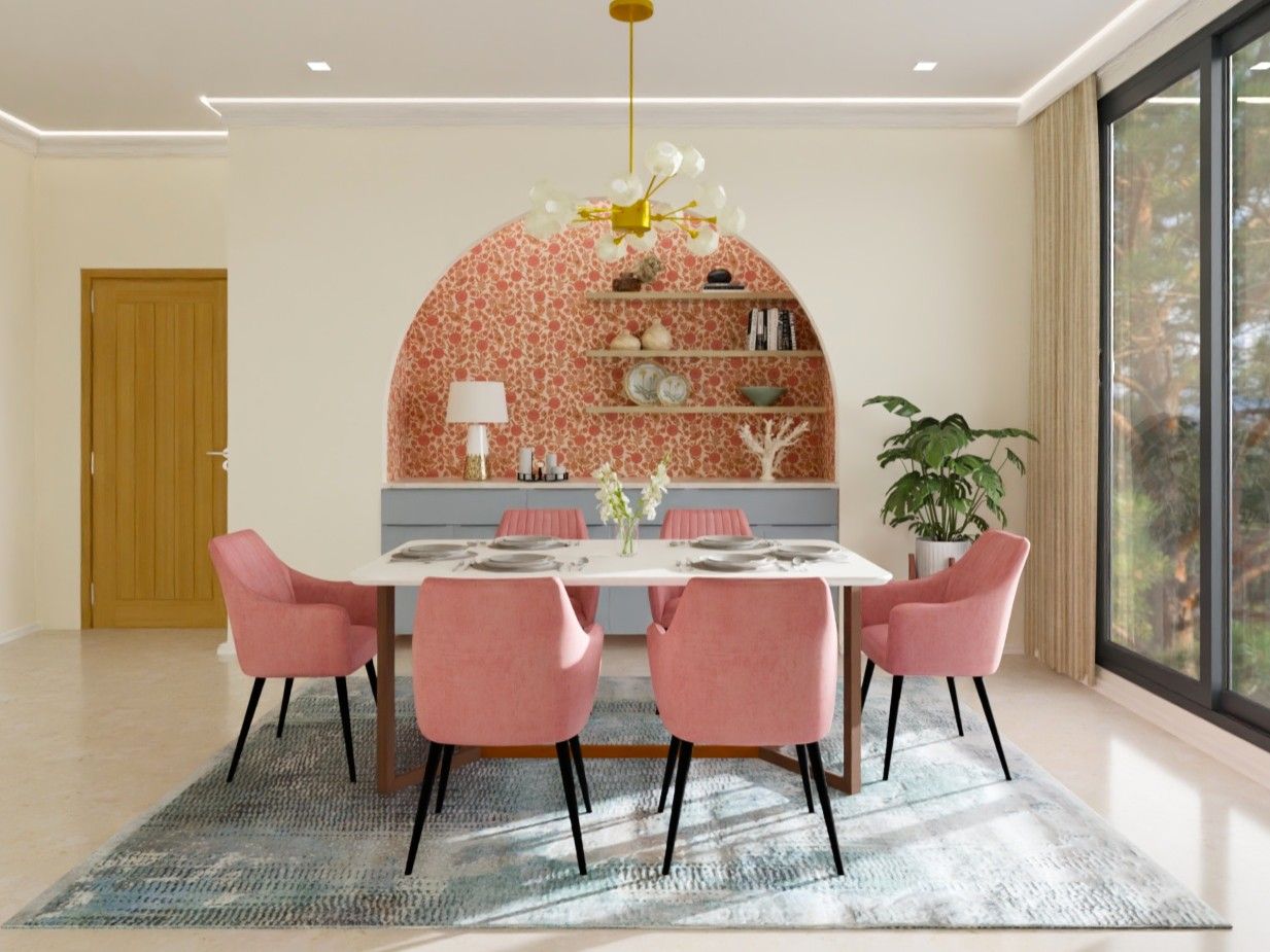 Eclectic dining room featuring a white table, pink chairs, and a floral arched niche - Beautiful Homes