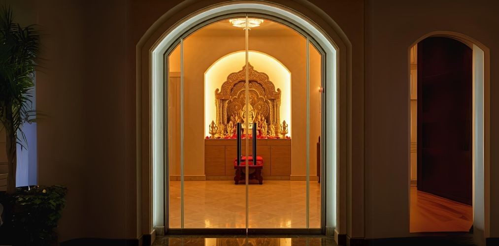 Arched glass door for pooja room - Beautiful Homes