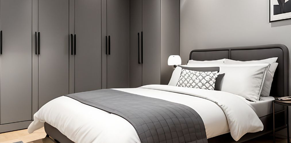 Grey guest bedroom design with modular wardrobe and black handles-Beautiful Homes