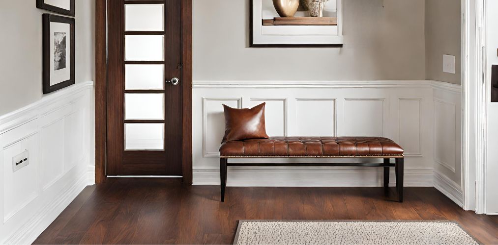 Simple foyer design with leather bench and wooden flooring-Beautiful Homes