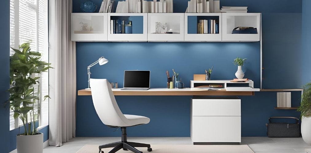 Modern blue home office with white study table and wall storage - Beautiful Homes