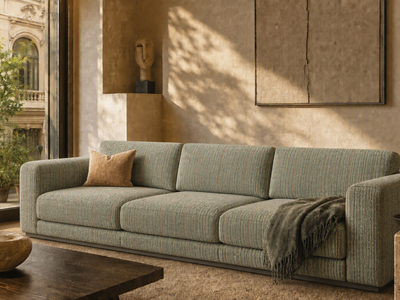 Low-profile three-seater sofa upholstered in textured green and beige striped fabric - Beautiful Homes