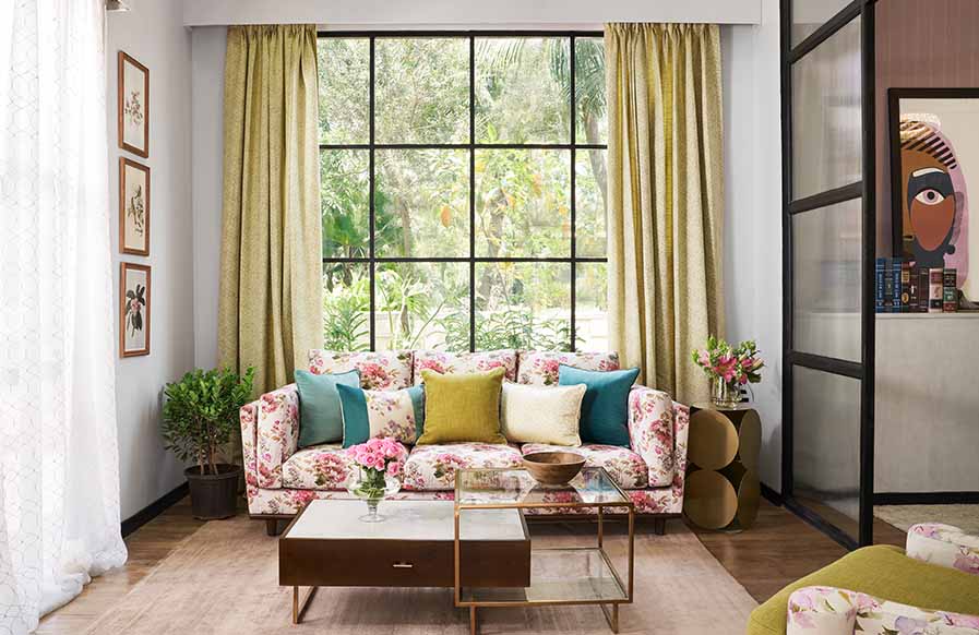 Classic white & vibrant living room design with floral motifs for upholstery - Beautiful Homes