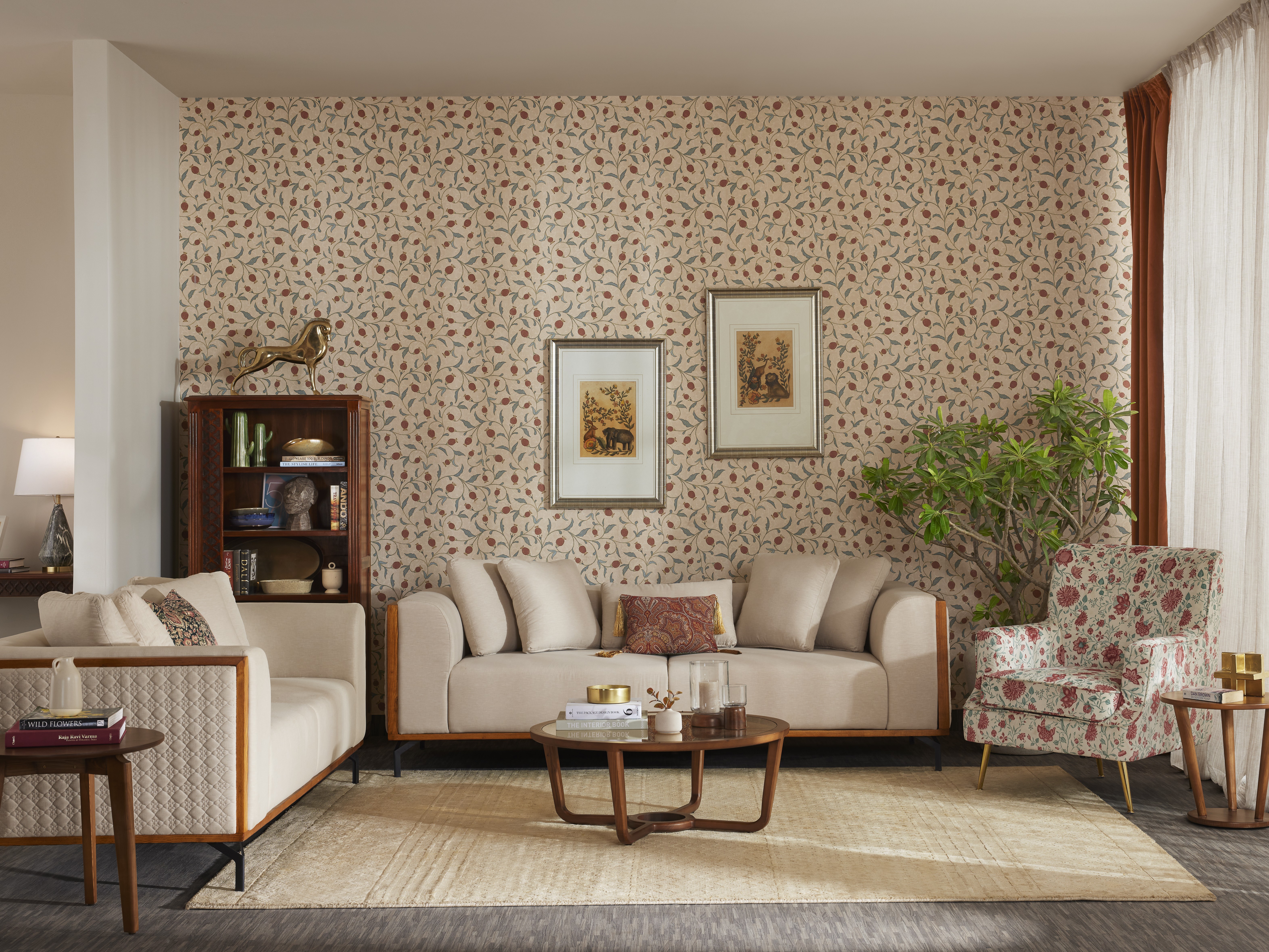 Chic living room with designer sofa set and floral upholstered accent chair - Beautiful Homes
