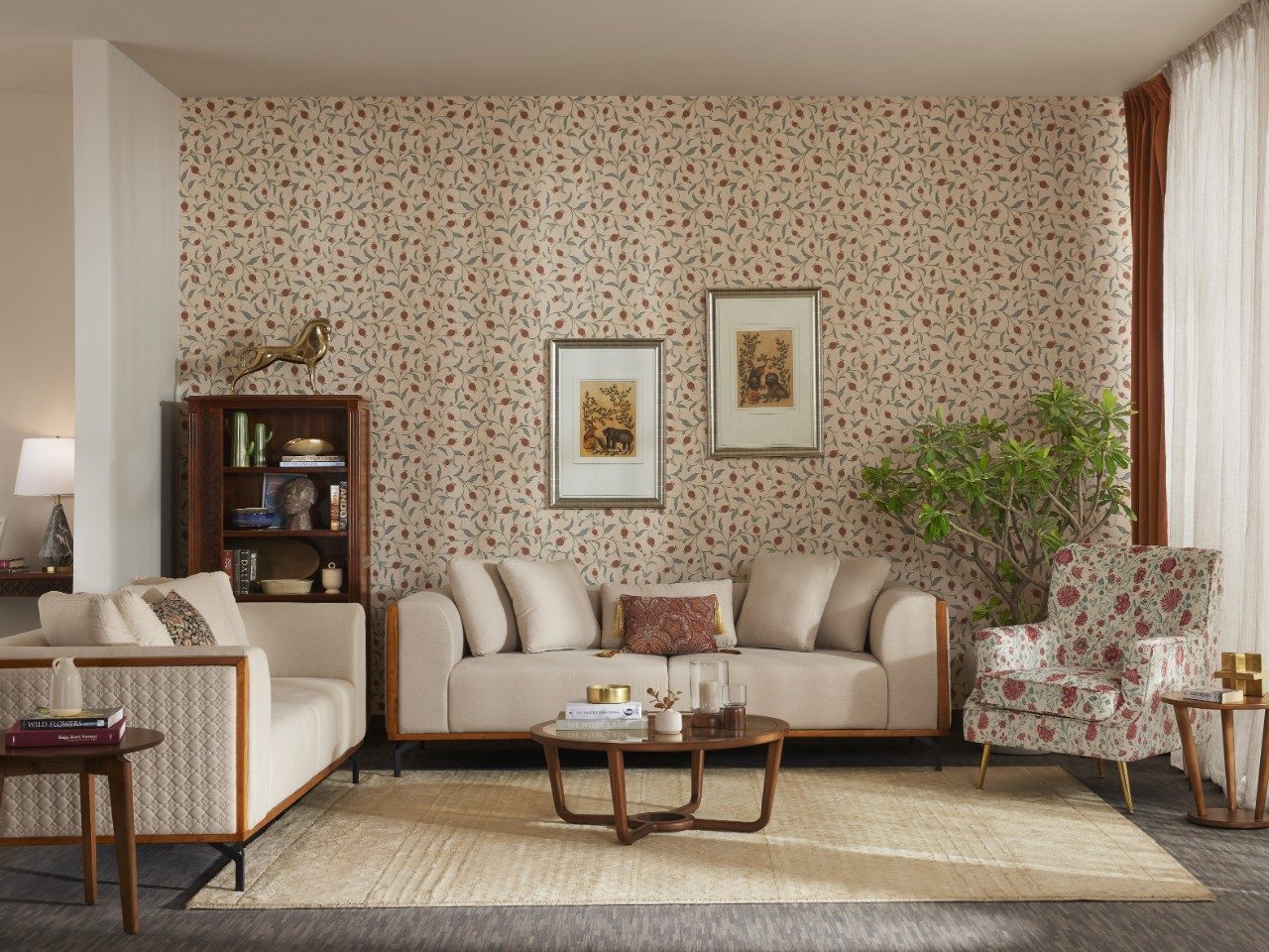 Chic living room with designer sofa set and floral upholstered accent chair - Beautiful Homes