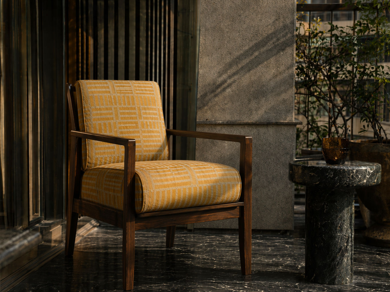 Armchair with mustard yellow geometric upholstery and a dark polished wooden frame - Beautiful Homes