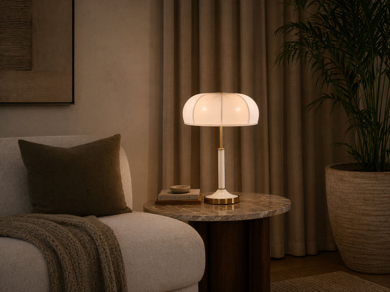 Modern table lamp with a ribbed white glowing shade, brass accents, and a white stem - Beautiful Homes