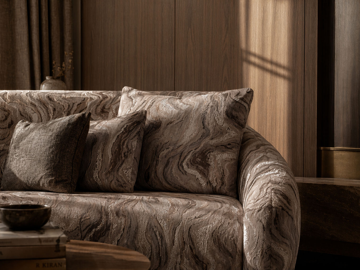 Contemporary sofa upholstered in rich brown marbled fabric with layered accent cushions - Beautiful Homes
