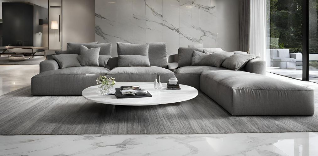 Contemporary living room with grey sofa and white marble flooring - Beautiful Homes