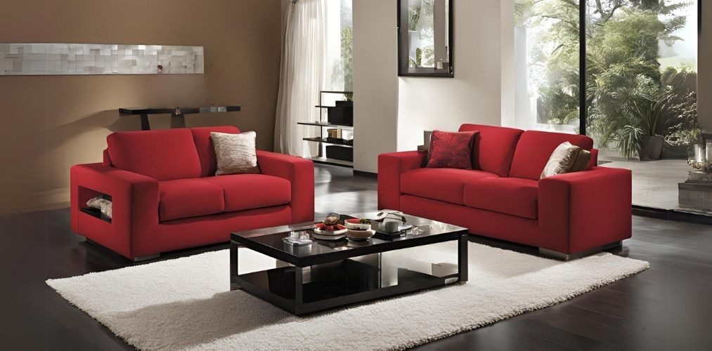 Contemporary living room with red sofas and black coffee table - Beautiful Homes