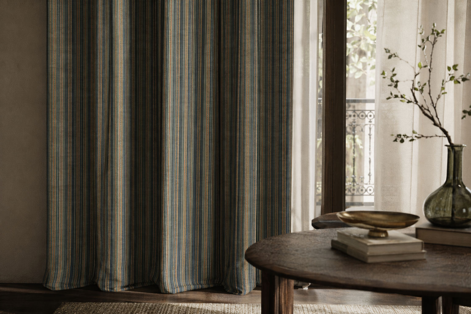 Floor-length curtain furnishing with a textured striped fabric in muted blue, teal, ochre, and cream tones, layered with soft sheer curtains - Beautiful Homes