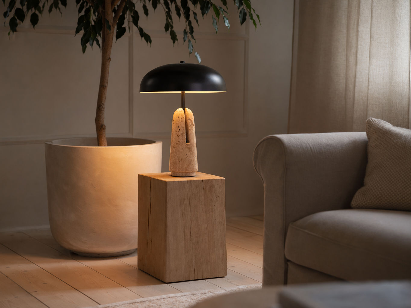 Contemporary table lamp with a matte black dome shade and sculptural beige stone base - Beautiful Homes