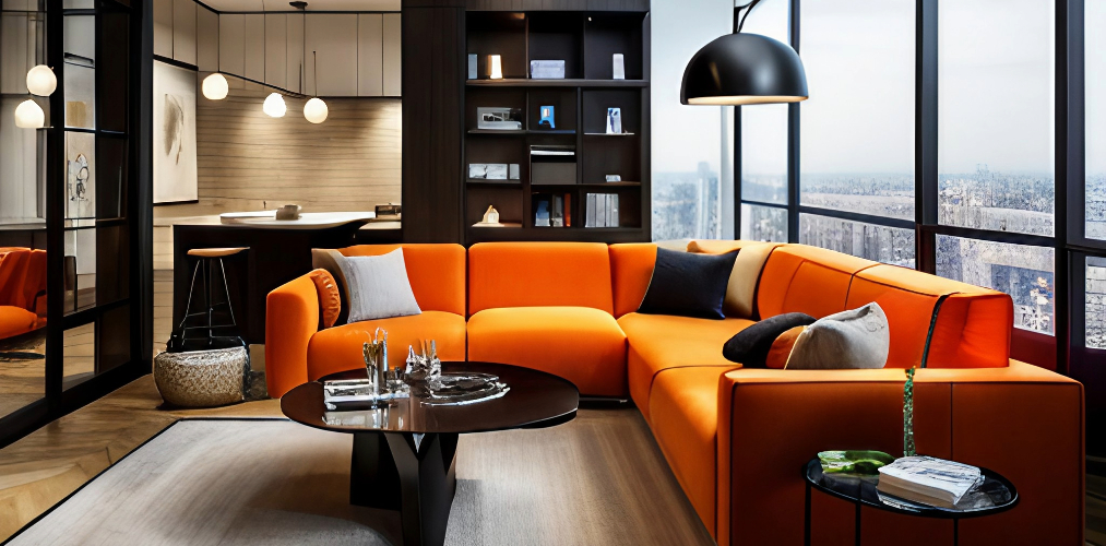 Designing living room with L shaped orange sofa and black center table-Beautiful Homes