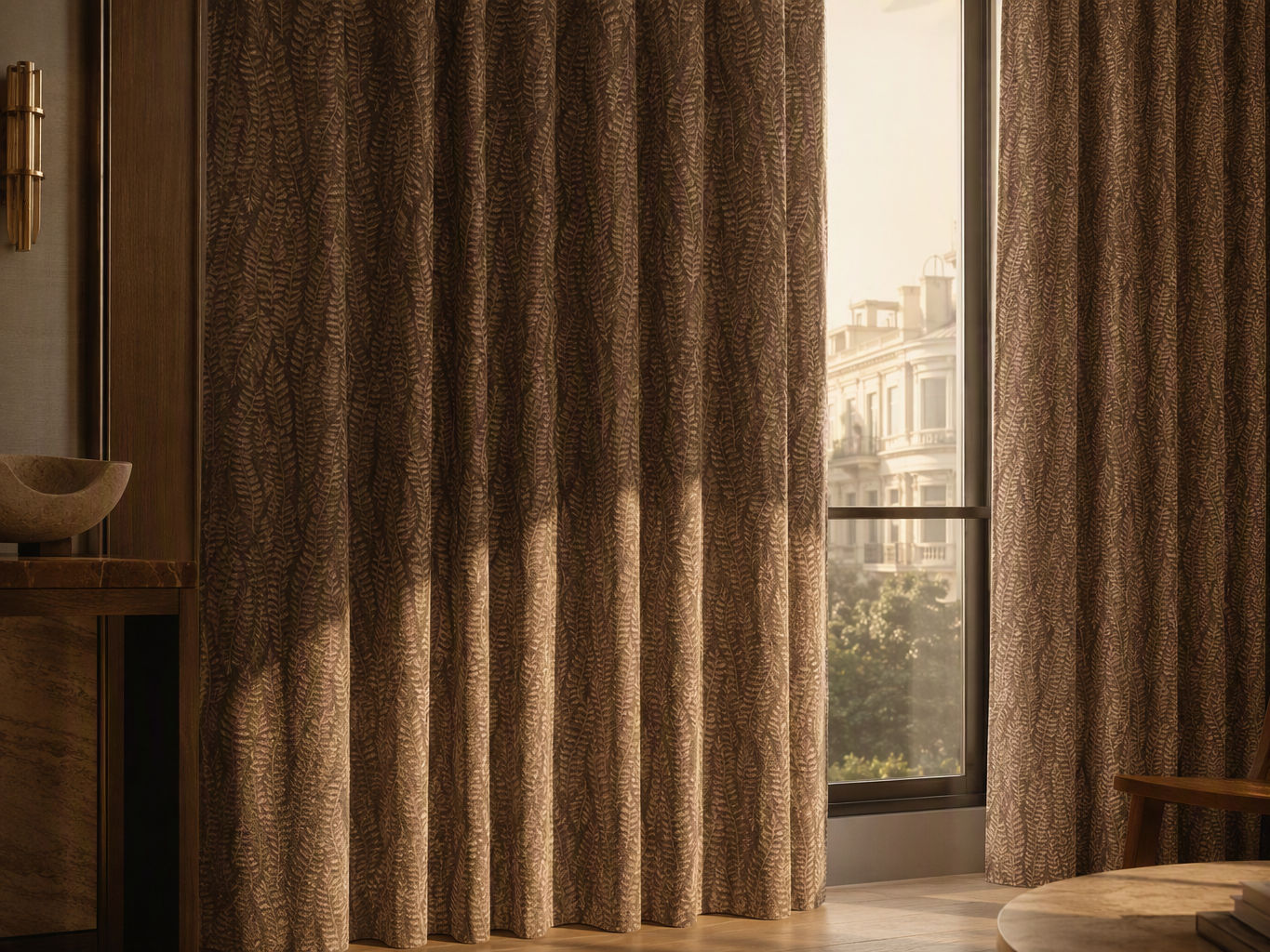 Floor-to-ceiling warm brown drapes with subtle fern leaf pattern framing a bright window - Beautiful Homes