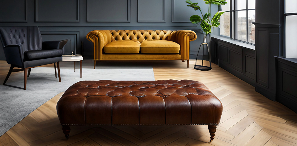 Living room with yellow chesterfield sofa and brown ottoman-Beautiful Homes