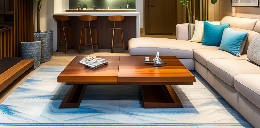 Wooden center table with grey sofa and blue carpet - Beautiful Homes