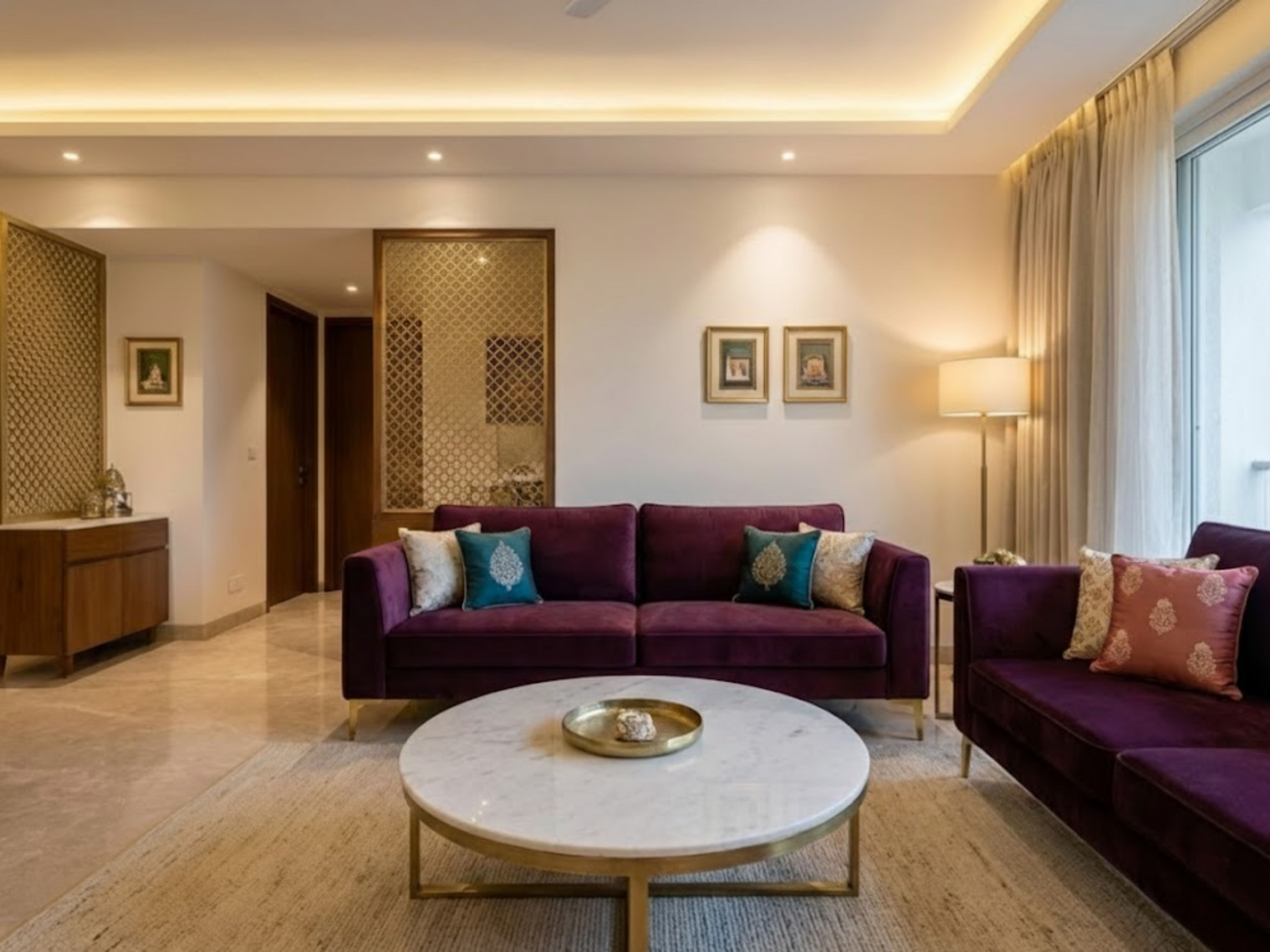 Living room with purple sofa and marble table - Beautiful Homes