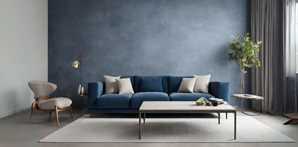 Minimalistic living room with blue sofa and textured wall - Beautiful Homes