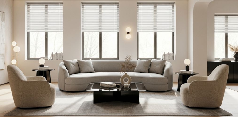 Living room with grey sofa and designer chairs - Beautiful Homes