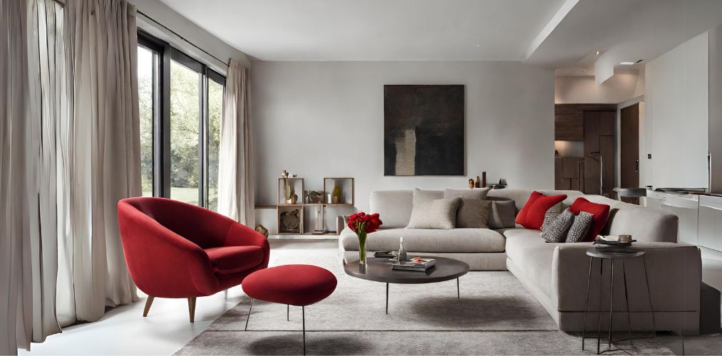 Modern living room with grey sofa and red accent chair-Beautiful Homes