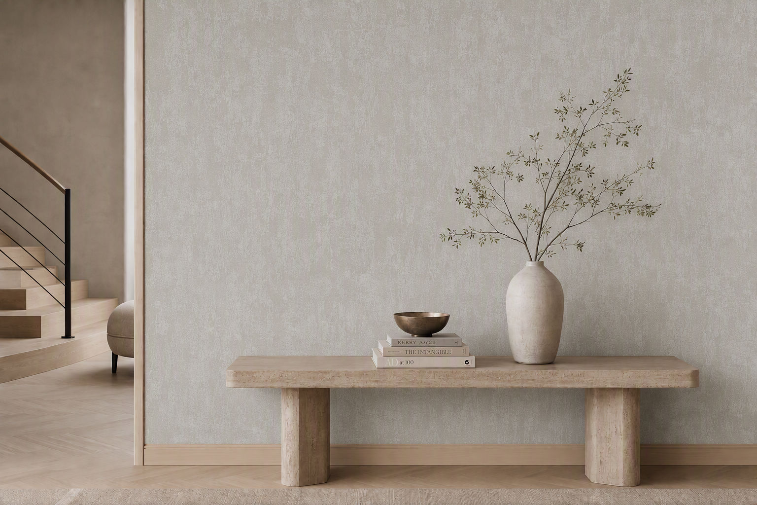 Soft beige textured plaster effect wallpaper behind a minimalist console bench - Beautiful Homes