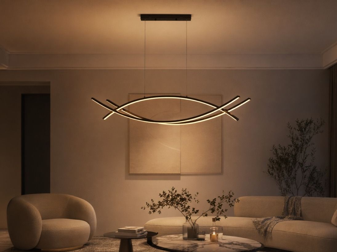 Black curved LED pendant light with a ribbon-like silhouette - Beautiful Homes