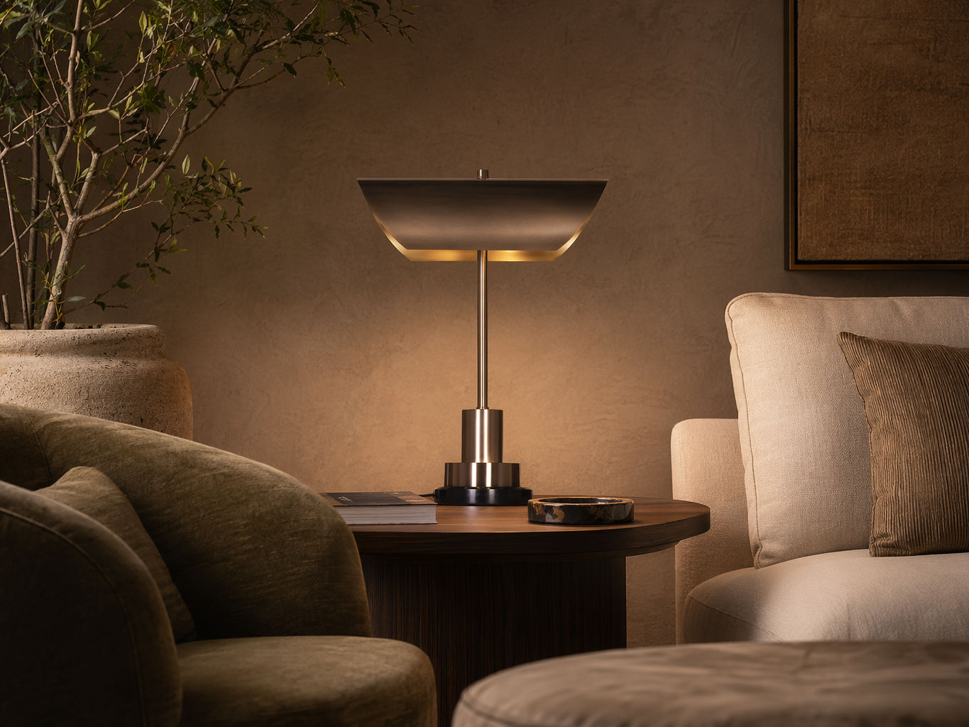 Modern table lamp with a curved brass shade, slender metallic stem, and tiered base - Beautiful Homes
