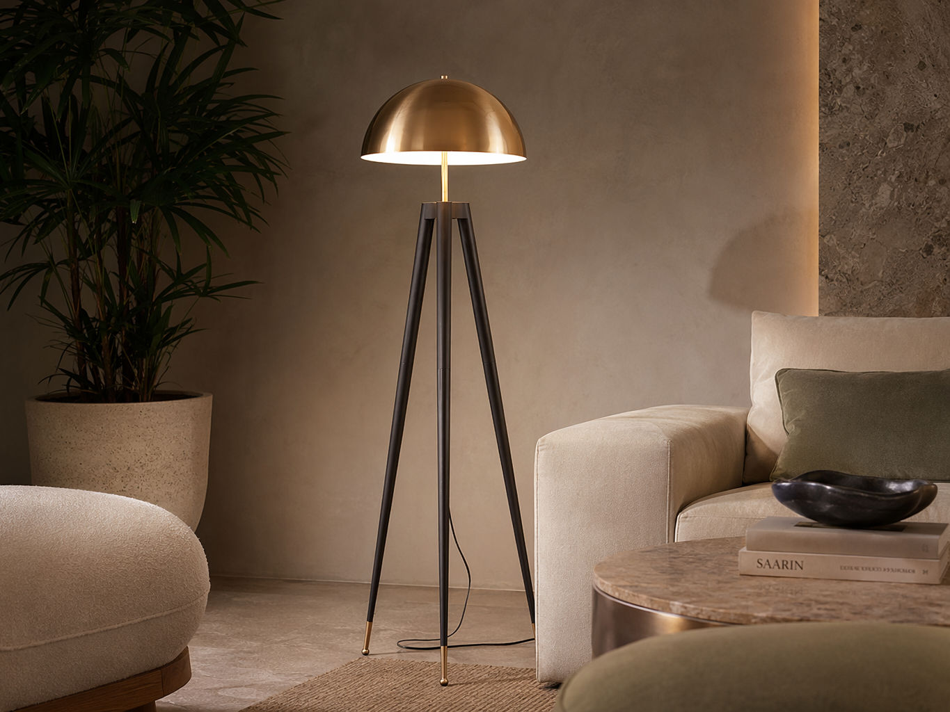 Floor lamp with a brushed brass dome shade, slim brass stem, and black tripod legs - Beautiful Homes