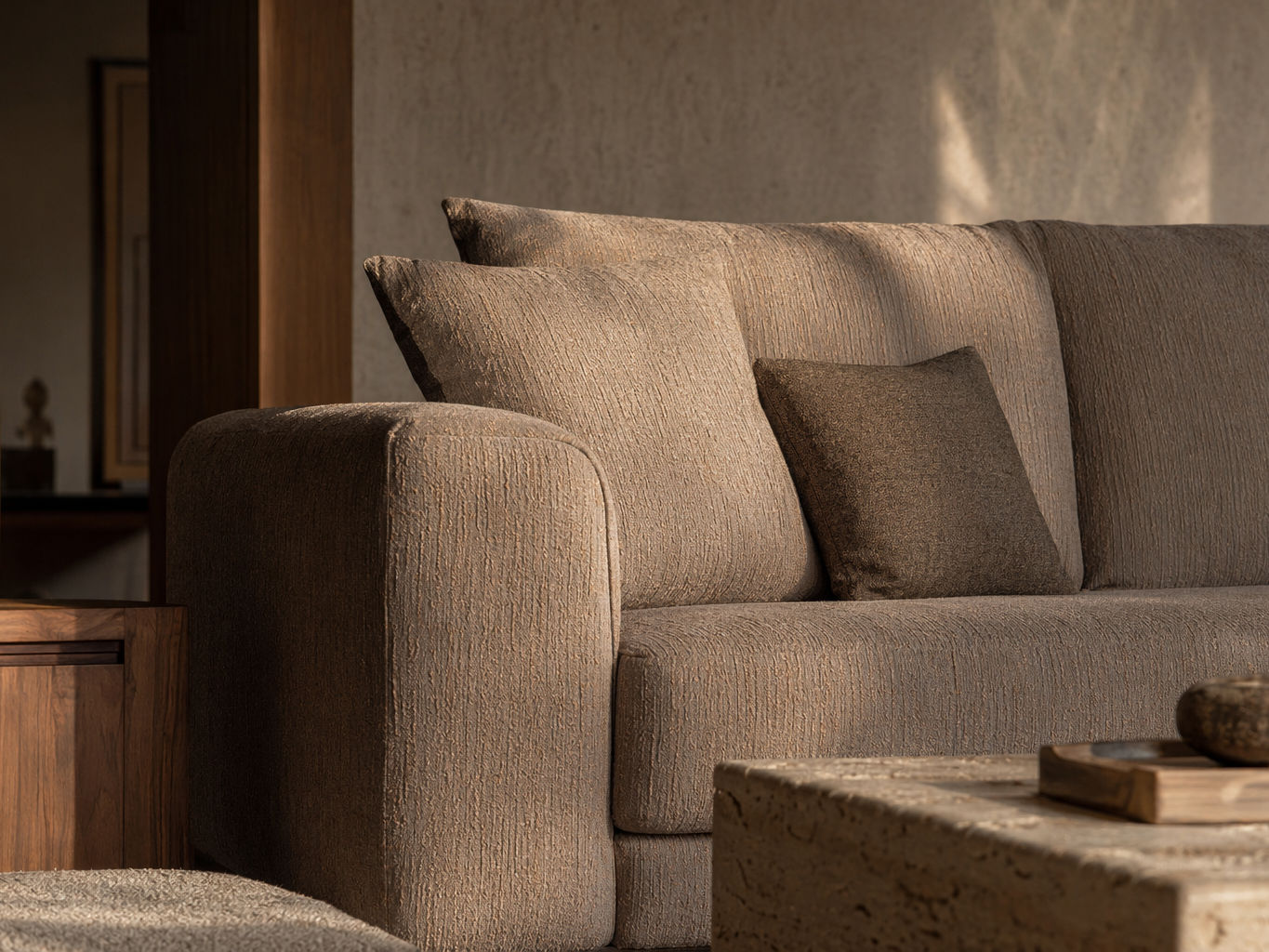Contemporary taupe sofa with rounded arms and richly textured upholstery - Beautiful Homes