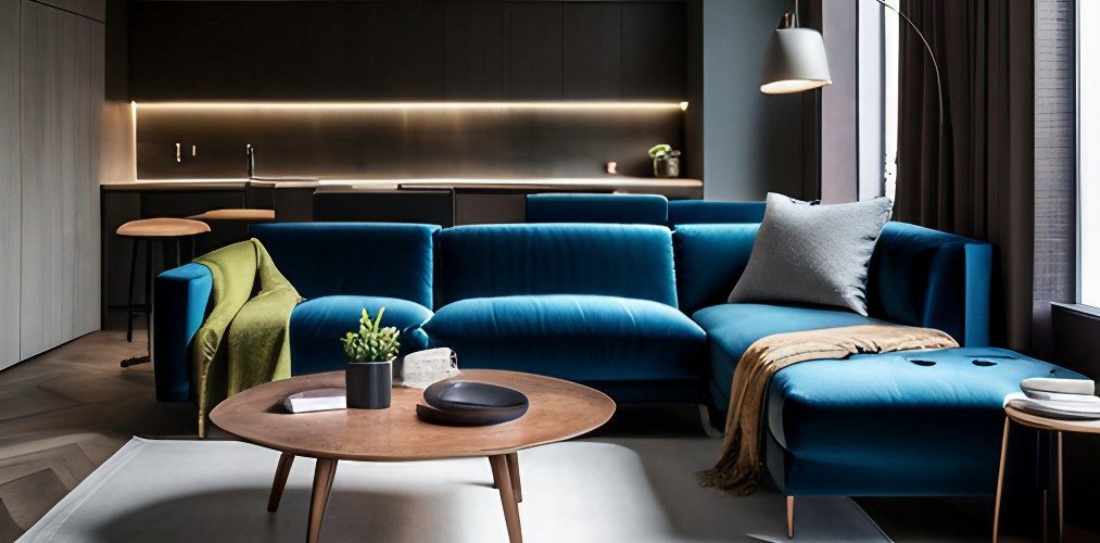 Simple living room with blue velvet sofa and wooden coffee table-Beautiful Homes